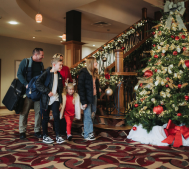 Family walking through the hotel foyer