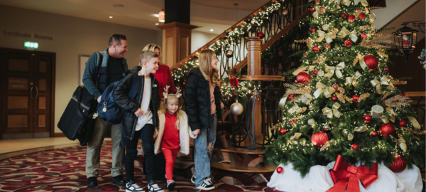Family walking through the hotel foyer
