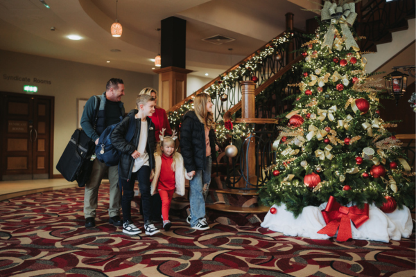 Family walking through the hotel foyer