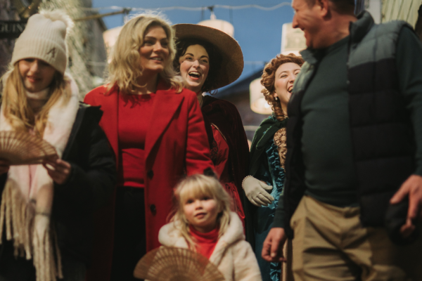 Family enjoying Georgian Festival with characters