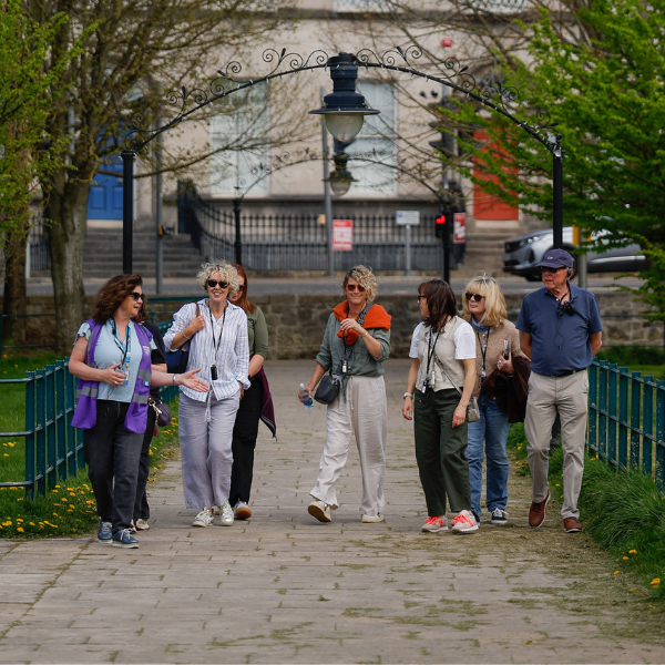 Group of people walking together through the Mall in Armagh