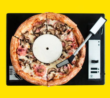 Pizza as record in DJ decks