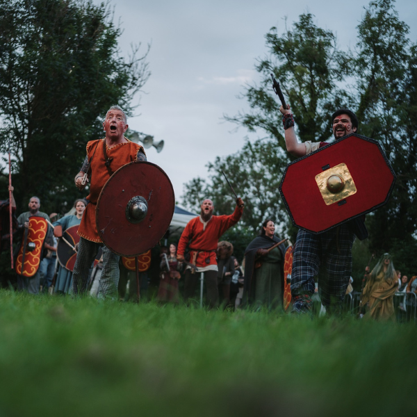 Warriors with shields and weapons during the Tales and Traditions Tour at Navan Fort.