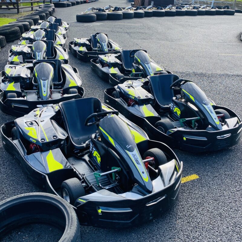 Gosford Karting Line up of black and green racing karts on track.