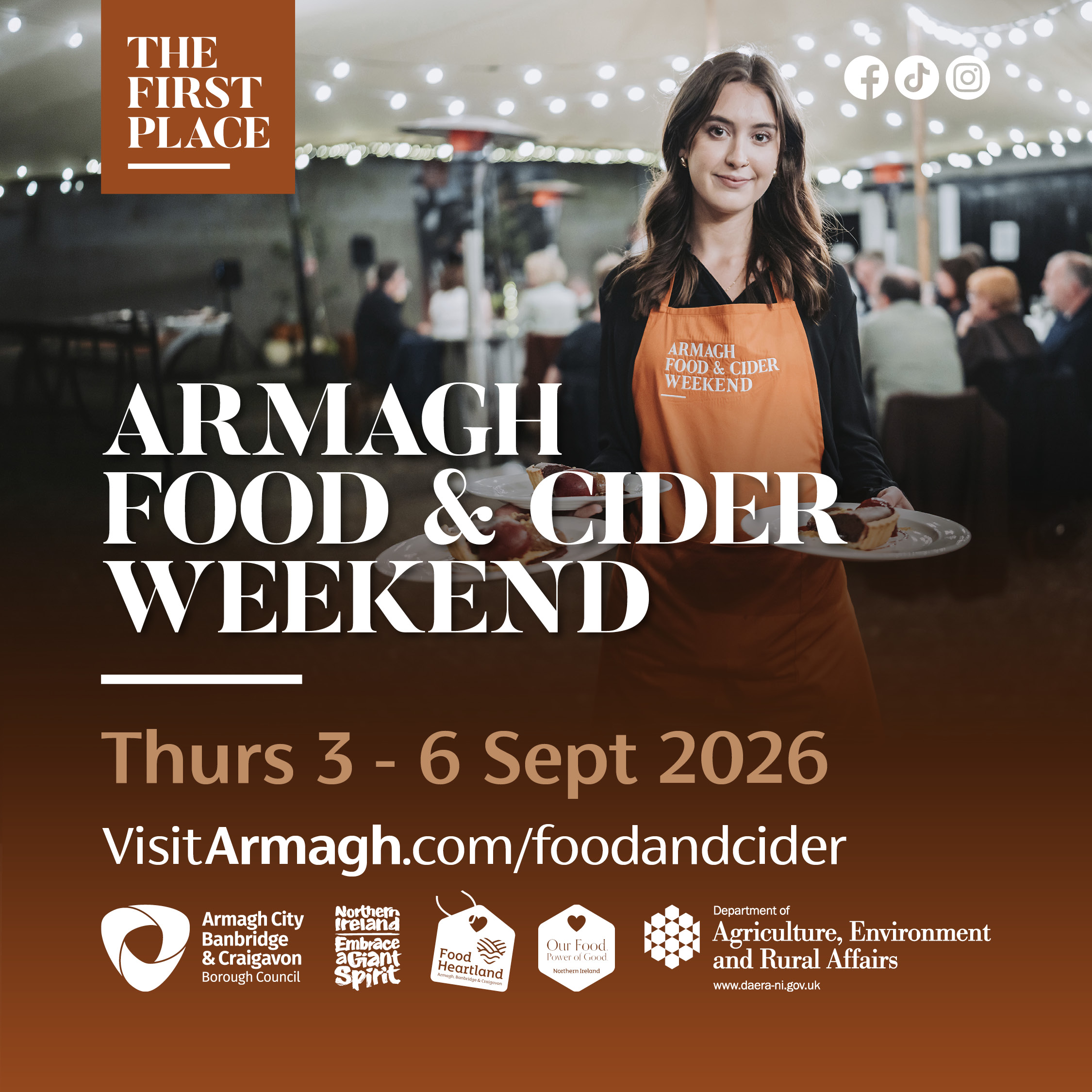 ARMAGH FOOD AND CIDER 2026 Promotional graphic for Armagh Food & Cider Weekend 2026, featuring a server wearing an event apron carrying plates of food at a dining event, with text showing dates 3–6 September 2026 and VisitArmagh.com/foodandcider.