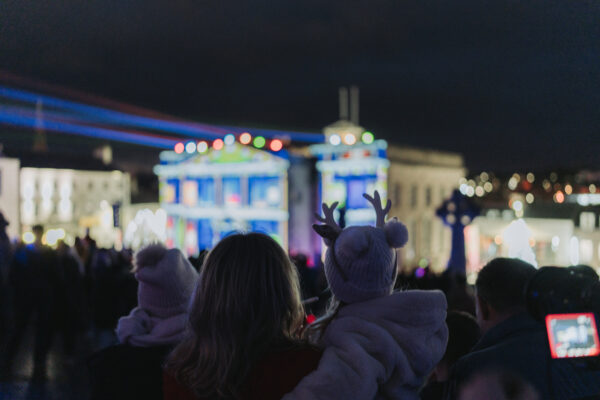 Crowds gathered in Market Square, Armagh, watching the Georgian Light Show projected onto historic building during the Armagh Georgian Festival.