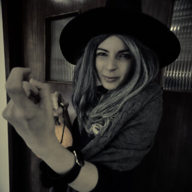 SONY DSC Person in a witch costume holding a lantern during Halloween Family Fun at Armagh County Museum.